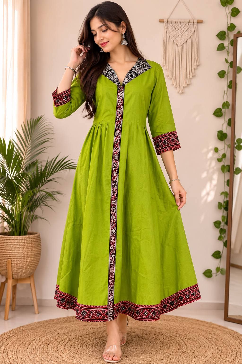 Mehndi green Ajrakh Anarkali kurta on display mannequin